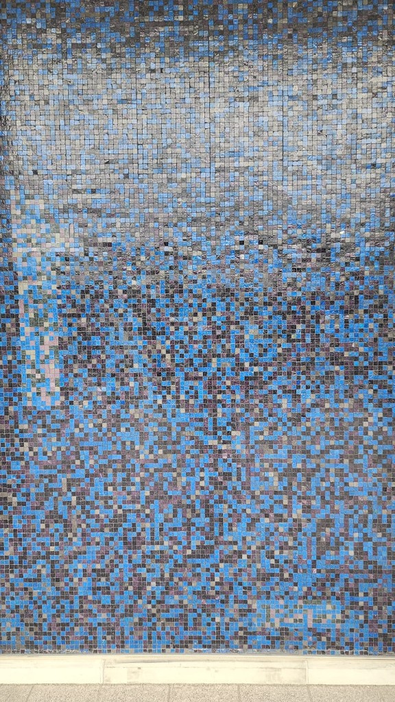 Glossy blue and grey mosaic tile wall