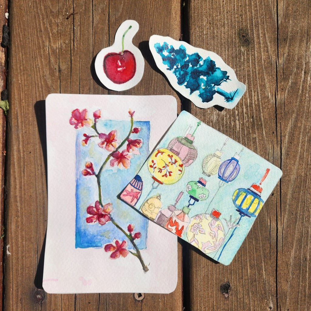 Cherry, foliage, blossom, and lantern watercolor pieces on wood